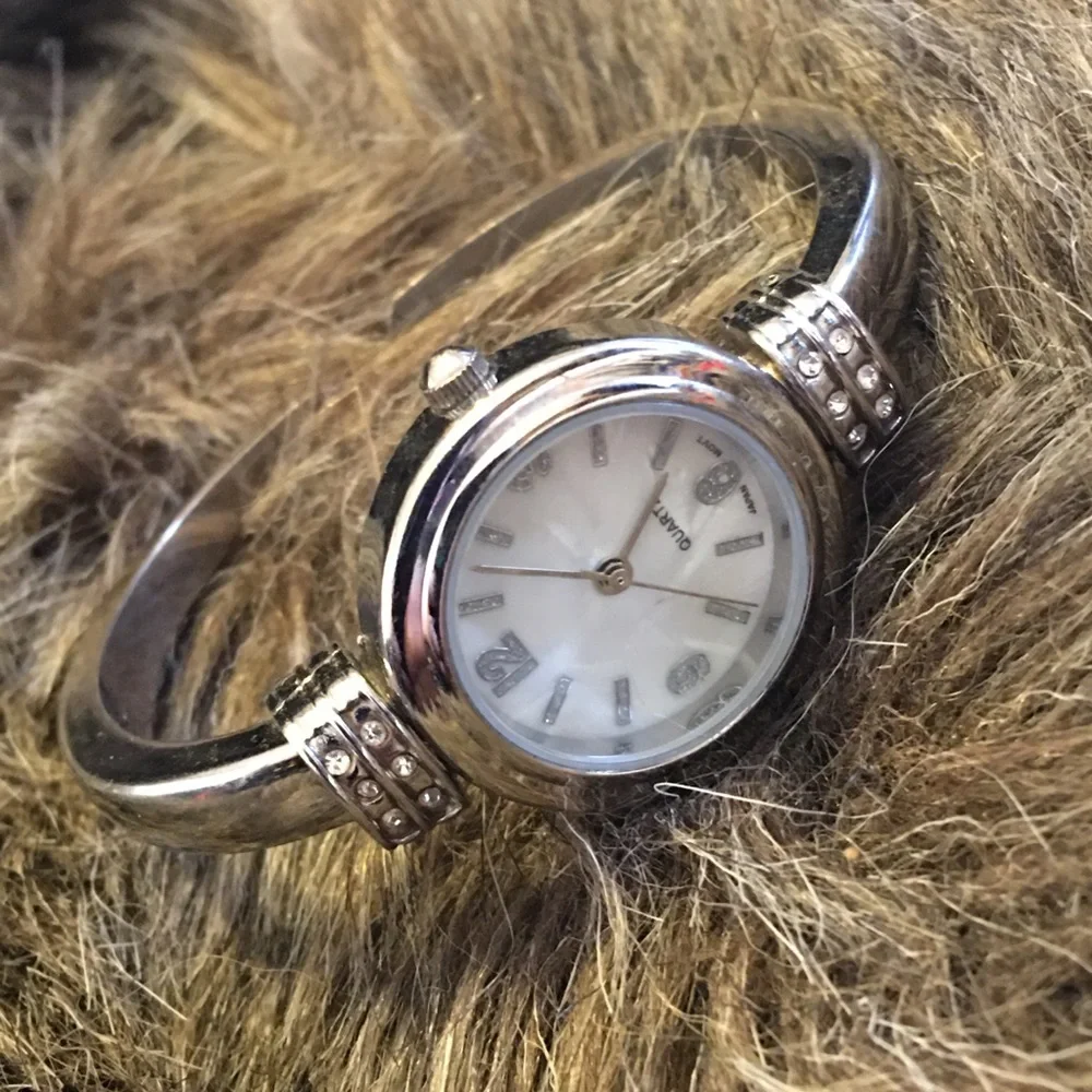 Ladies shiny silver rhinestone accent cuff watch